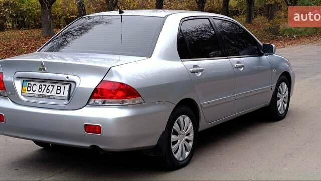 Серый Мицубиси Лансер, объемом двигателя 1.58 л и пробегом 176 тыс. км за 5000 $, фото 4 на Automoto.ua