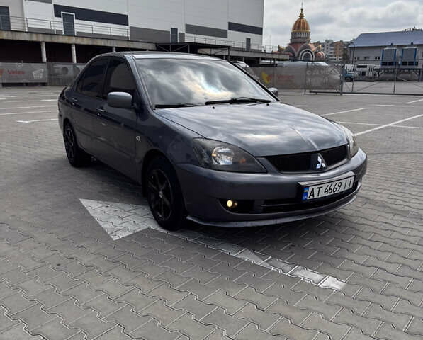 Серый Мицубиси Лансер, объемом двигателя 1.58 л и пробегом 250 тыс. км за 4300 $, фото 1 на Automoto.ua
