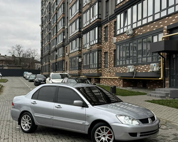 Сірий Міцубісі Lancer, об'ємом двигуна 1.6 л та пробігом 269 тис. км за 3999 $, фото 1 на Automoto.ua