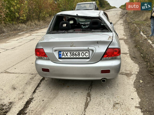Серый Мицубиси Лансер, объемом двигателя 1.6 л и пробегом 247 тыс. км за 2420 $, фото 1 на Automoto.ua