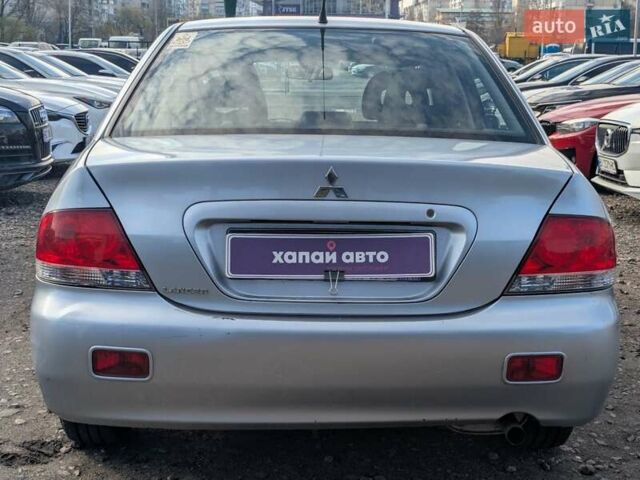 Серый Мицубиси Лансер, объемом двигателя 1.6 л и пробегом 155 тыс. км за 5200 $, фото 5 на Automoto.ua