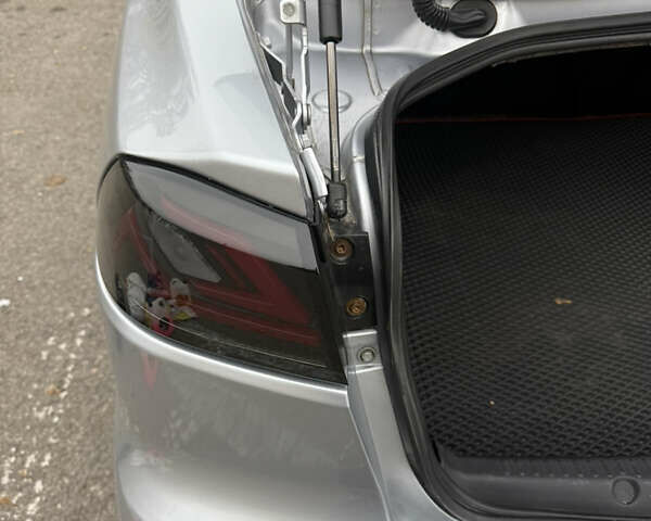 Сірий Міцубісі Lancer, об'ємом двигуна 2 л та пробігом 253 тис. км за 8700 $, фото 21 на Automoto.ua