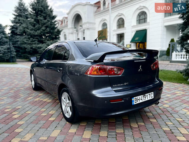 Серый Мицубиси Лансер, объемом двигателя 2 л и пробегом 212 тыс. км за 6000 $, фото 7 на Automoto.ua