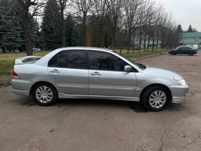 Сірий Міцубісі Lancer, об'ємом двигуна 1.6 л та пробігом 254 тис. км за 3800 $, фото 3 на Automoto.ua