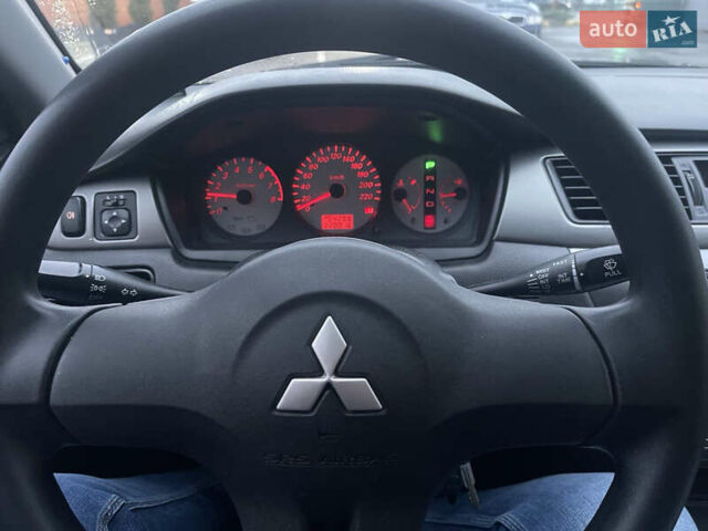 Сірий Міцубісі Lancer, об'ємом двигуна 1.58 л та пробігом 220 тис. км за 5900 $, фото 8 на Automoto.ua