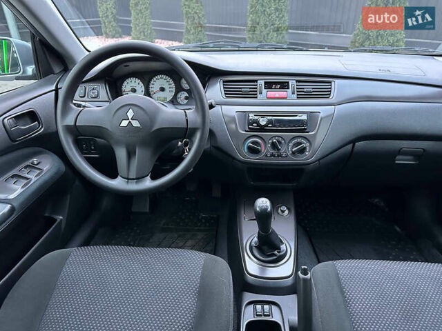 Серый Мицубиси Лансер, объемом двигателя 1.58 л и пробегом 34 тыс. км за 7500 $, фото 40 на Automoto.ua