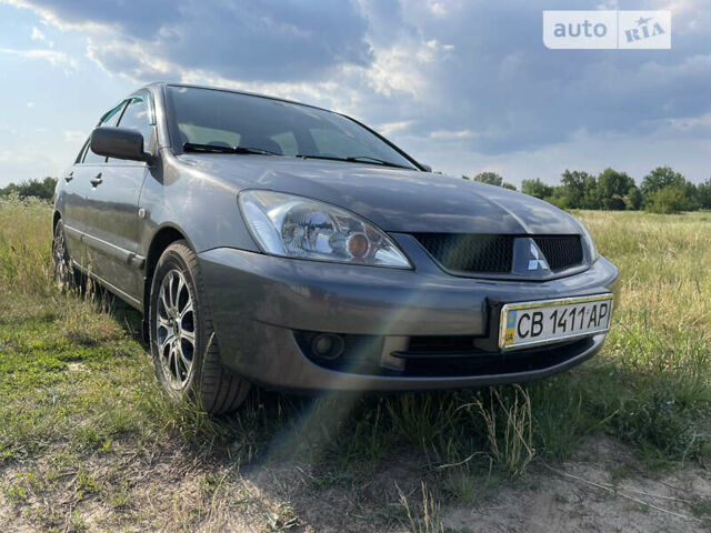 Сірий Міцубісі Lancer, об'ємом двигуна 1.6 л та пробігом 165 тис. км за 5200 $, фото 1 на Automoto.ua