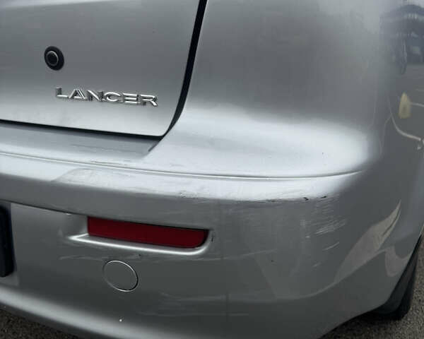 Сірий Міцубісі Lancer, об'ємом двигуна 2 л та пробігом 185 тис. км за 7000 $, фото 6 на Automoto.ua