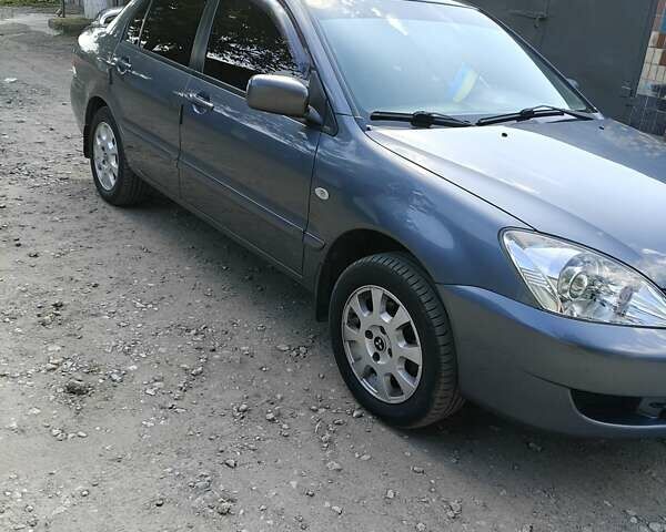 Сірий Міцубісі Lancer, об'ємом двигуна 1.58 л та пробігом 97 тис. км за 6800 $, фото 2 на Automoto.ua