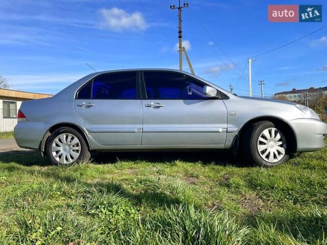 Сірий Міцубісі Lancer, об'ємом двигуна 1.6 л та пробігом 364 тис. км за 4300 $, фото 4 на Automoto.ua