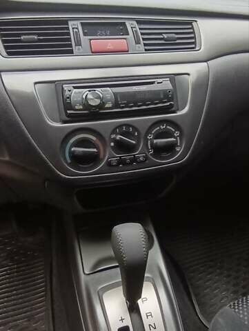Сірий Міцубісі Lancer, об'ємом двигуна 1.6 л та пробігом 176 тис. км за 4999 $, фото 26 на Automoto.ua