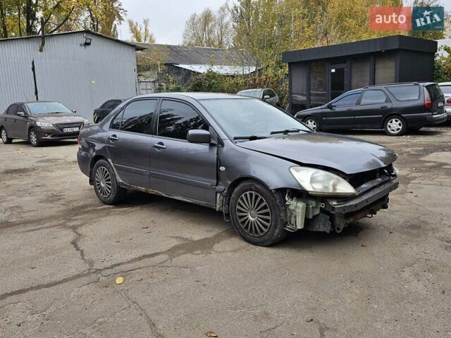 Сірий Міцубісі Lancer, об'ємом двигуна 1.58 л та пробігом 200 тис. км за 1700 $, фото 9 на Automoto.ua