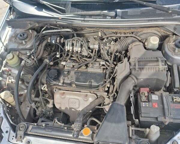 Сірий Міцубісі Lancer, об'ємом двигуна 1.6 л та пробігом 217 тис. км за 6000 $, фото 6 на Automoto.ua