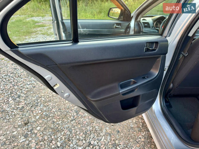 Сірий Міцубісі Lancer, об'ємом двигуна 2 л та пробігом 223 тис. км за 7390 $, фото 14 на Automoto.ua