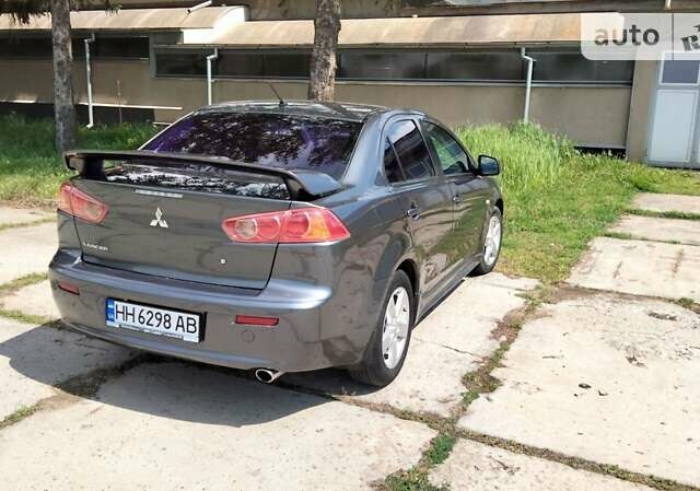 Сірий Міцубісі Lancer, об'ємом двигуна 2 л та пробігом 221 тис. км за 7100 $, фото 4 на Automoto.ua