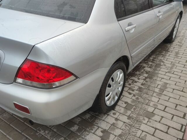 Серый Мицубиси Лансер, объемом двигателя 1.6 л и пробегом 225 тыс. км за 3100 $, фото 2 на Automoto.ua