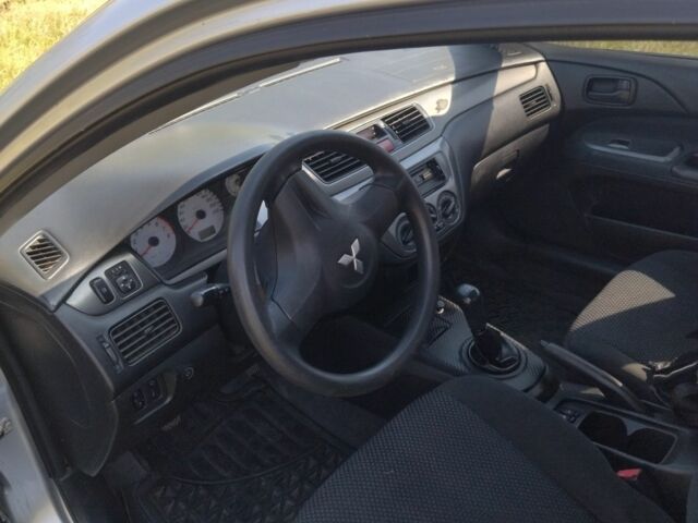 Серый Мицубиси Лансер, объемом двигателя 1.6 л и пробегом 350 тыс. км за 3600 $, фото 2 на Automoto.ua