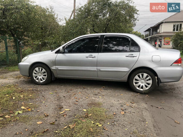 Сірий Міцубісі Lancer, об'ємом двигуна 1.58 л та пробігом 240 тис. км за 4299 $, фото 9 на Automoto.ua