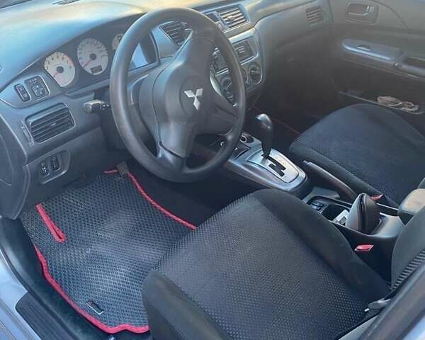 Серый Мицубиси Лансер, объемом двигателя 1.6 л и пробегом 242 тыс. км за 4500 $, фото 6 на Automoto.ua