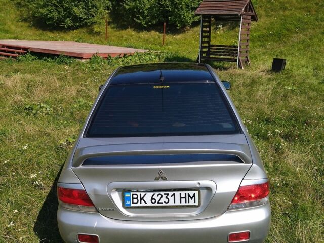 Серый Мицубиси Лансер, объемом двигателя 1.6 л и пробегом 350 тыс. км за 3600 $, фото 4 на Automoto.ua