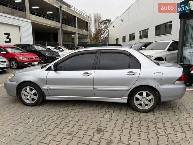 Сірий Міцубісі Lancer, об'ємом двигуна 1.6 л та пробігом 206 тис. км за 4799 $, фото 3 на Automoto.ua