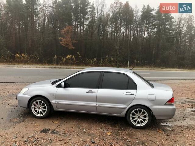 Серый Мицубиси Лансер, объемом двигателя 1.58 л и пробегом 268 тыс. км за 3450 $, фото 3 на Automoto.ua