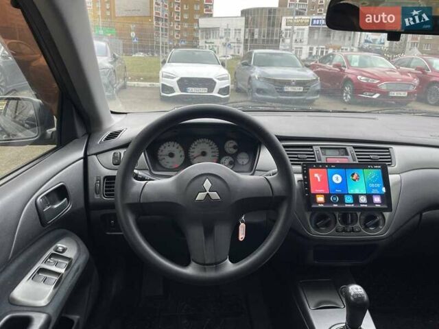 Серый Мицубиси Лансер, объемом двигателя 1.58 л и пробегом 146 тыс. км за 5490 $, фото 13 на Automoto.ua