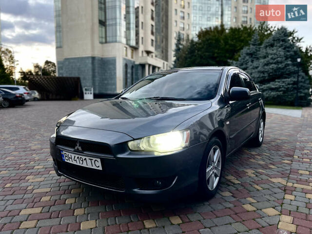 Серый Мицубиси Лансер, объемом двигателя 2 л и пробегом 212 тыс. км за 6000 $, фото 18 на Automoto.ua