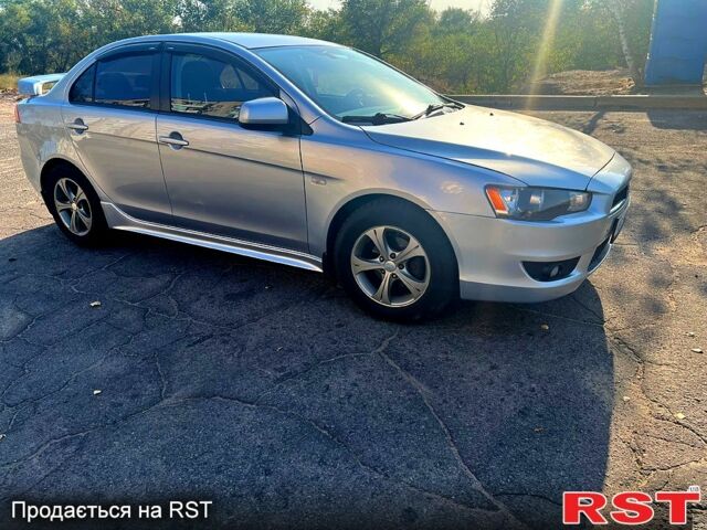 Серый Мицубиси Лансер, объемом двигателя 2 л и пробегом 151 тыс. км за 6099 $, фото 2 на Automoto.ua