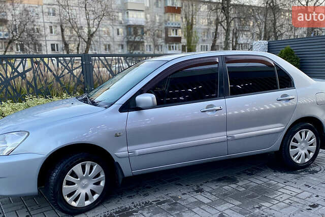 Серый Мицубиси Лансер, объемом двигателя 1.6 л и пробегом 203 тыс. км за 5200 $, фото 2 на Automoto.ua