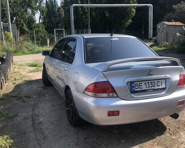 Сірий Міцубісі Lancer, об'ємом двигуна 1.6 л та пробігом 112 тис. км за 7000 $, фото 5 на Automoto.ua