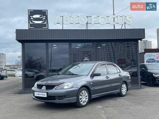 Серый Мицубиси Лансер, объемом двигателя 1.58 л и пробегом 146 тыс. км за 5490 $, фото 3 на Automoto.ua
