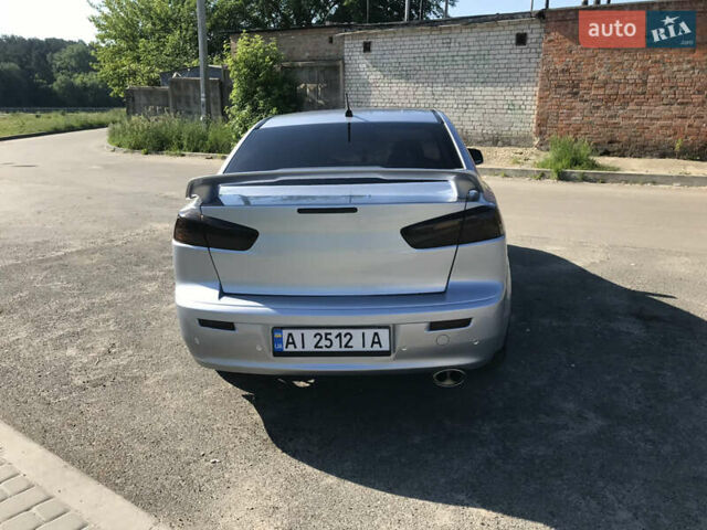 Серый Мицубиси Лансер, объемом двигателя 2 л и пробегом 256 тыс. км за 7000 $, фото 4 на Automoto.ua