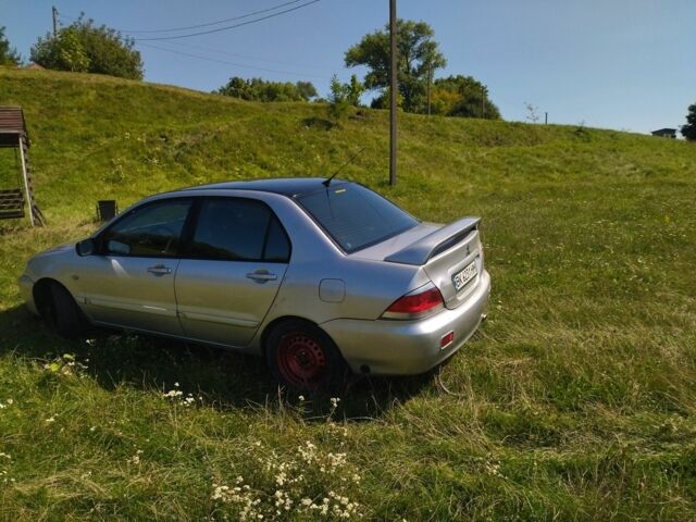 Серый Мицубиси Лансер, объемом двигателя 1.6 л и пробегом 350 тыс. км за 3600 $, фото 6 на Automoto.ua