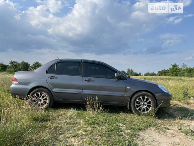 Сірий Міцубісі Lancer, об'ємом двигуна 1.6 л та пробігом 165 тис. км за 5200 $, фото 6 на Automoto.ua