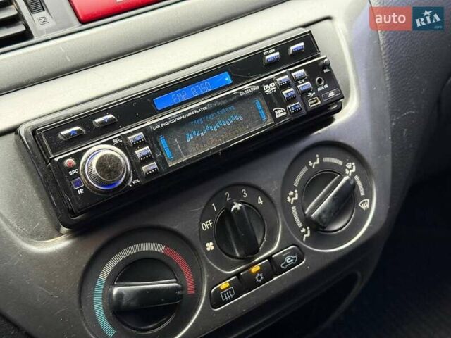 Сірий Міцубісі Lancer, об'ємом двигуна 1.6 л та пробігом 206 тис. км за 4799 $, фото 15 на Automoto.ua
