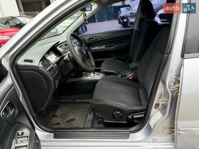 Сірий Міцубісі Lancer, об'ємом двигуна 1.6 л та пробігом 206 тис. км за 4799 $, фото 18 на Automoto.ua