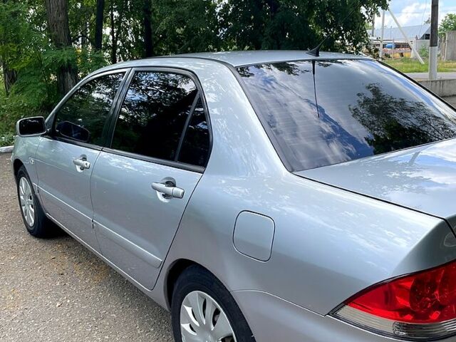 Сірий Міцубісі Lancer, об'ємом двигуна 1.6 л та пробігом 204 тис. км за 4500 $, фото 4 на Automoto.ua