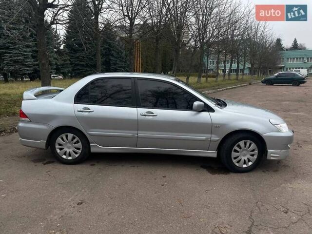 Сірий Міцубісі Lancer, об'ємом двигуна 1.6 л та пробігом 254 тис. км за 3800 $, фото 3 на Automoto.ua