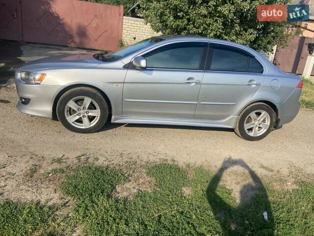 Серый Мицубиси Лансер, объемом двигателя 2 л и пробегом 266 тыс. км за 7000 $, фото 6 на Automoto.ua