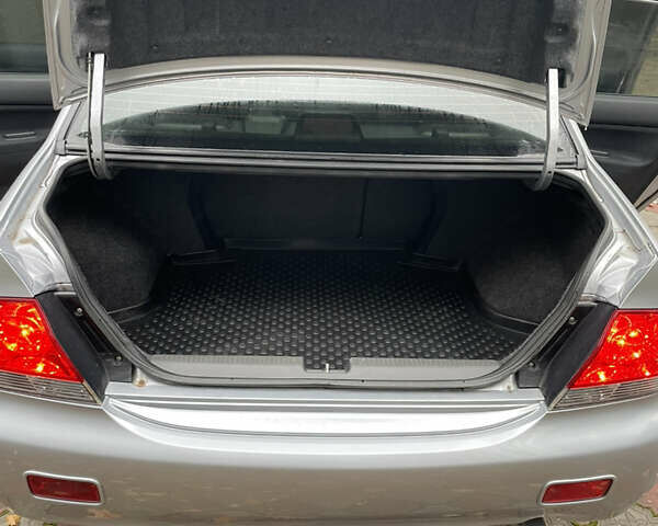 Сірий Міцубісі Lancer, об'ємом двигуна 1.59 л та пробігом 219 тис. км за 4500 $, фото 19 на Automoto.ua