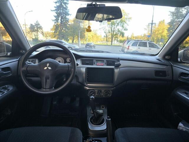 Серый Мицубиси Лансер, объемом двигателя 1.6 л и пробегом 150 тыс. км за 4700 $, фото 4 на Automoto.ua