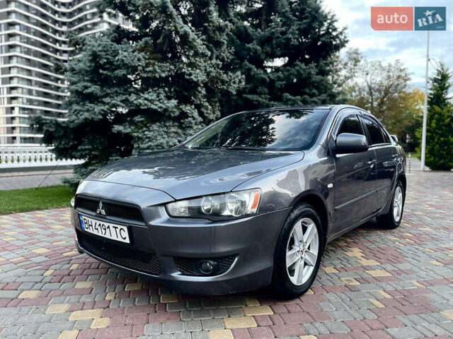 Серый Мицубиси Лансер, объемом двигателя 2 л и пробегом 212 тыс. км за 6000 $, фото 1 на Automoto.ua