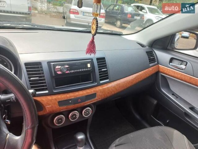 Серый Мицубиси Лансер, объемом двигателя 2 л и пробегом 103 тыс. км за 7700 $, фото 12 на Automoto.ua
