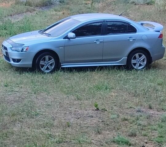 Сірий Міцубісі Lancer, об'ємом двигуна 2 л та пробігом 138 тис. км за 6999 $, фото 1 на Automoto.ua