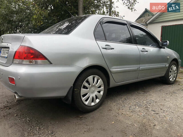Сірий Міцубісі Lancer, об'ємом двигуна 1.58 л та пробігом 240 тис. км за 4299 $, фото 3 на Automoto.ua