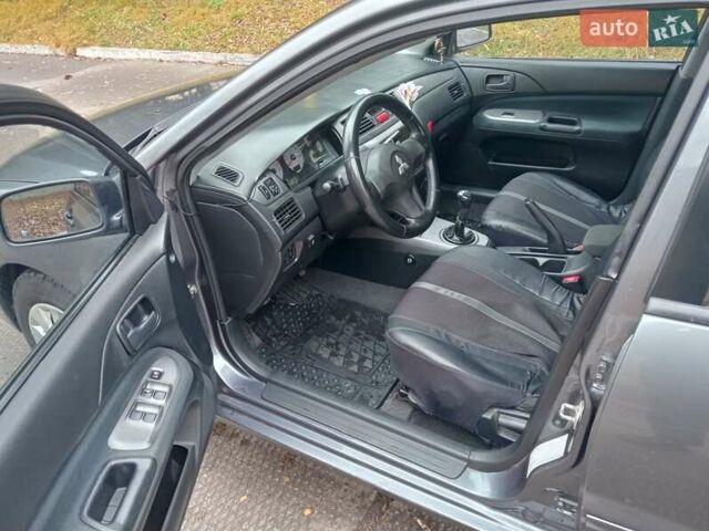 Серый Мицубиси Лансер, объемом двигателя 1.58 л и пробегом 205 тыс. км за 3300 $, фото 5 на Automoto.ua