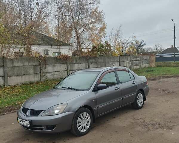 Сірий Міцубісі Lancer, об'ємом двигуна 1.58 л та пробігом 1 тис. км за 2850 $, фото 1 на Automoto.ua
