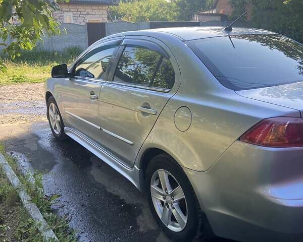 Серый Мицубиси Лансер, объемом двигателя 2 л и пробегом 266 тыс. км за 7000 $, фото 16 на Automoto.ua