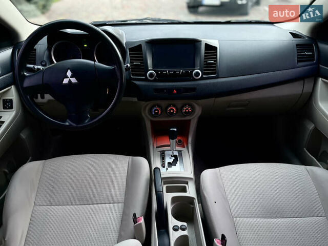Серый Мицубиси Лансер, объемом двигателя 2 л и пробегом 212 тыс. км за 6000 $, фото 26 на Automoto.ua